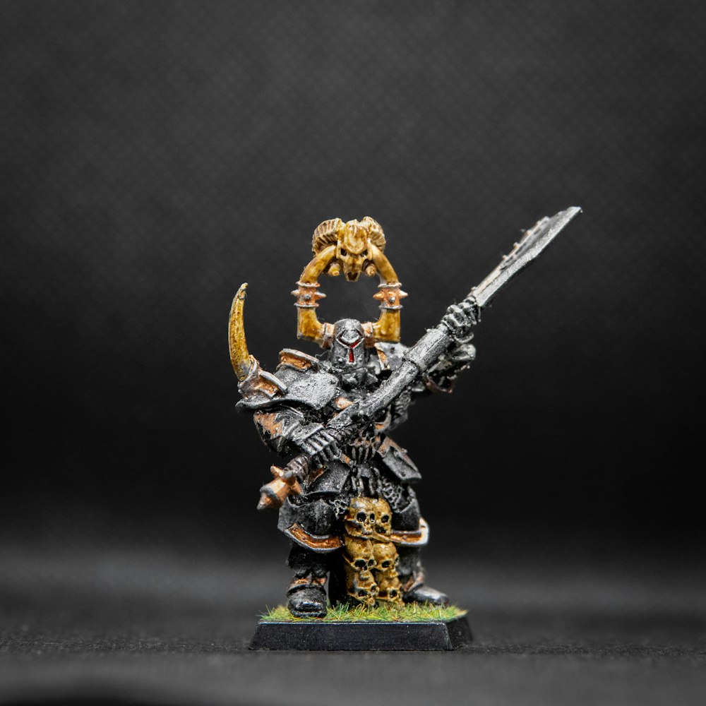 a warhammer with a sword and a skull on it