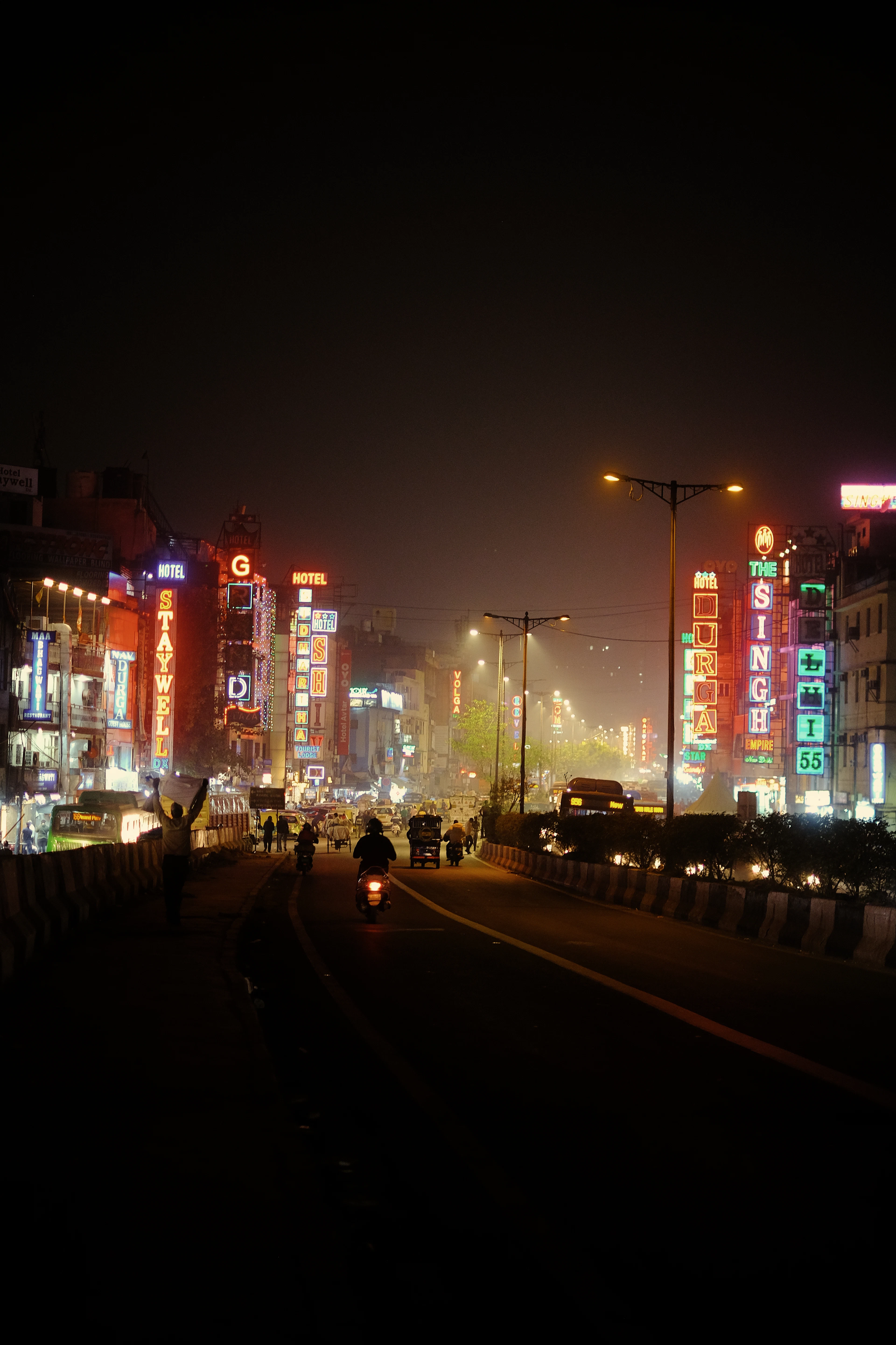 A Delhi street lit up at night