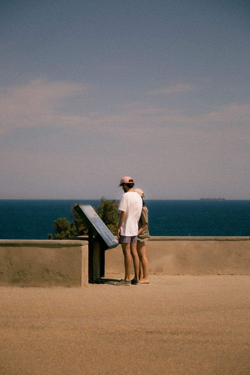 a couple of people that are looking at the water