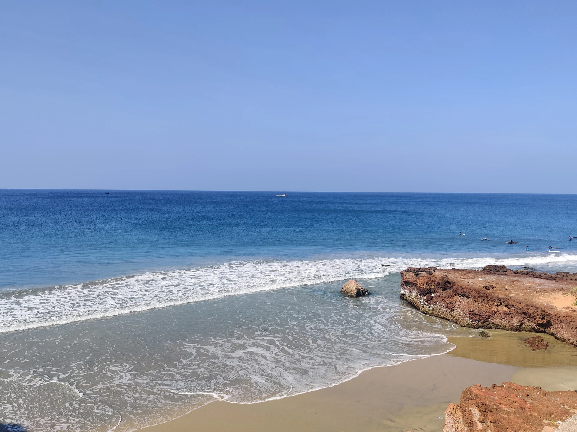 a body of water with waves coming in to shore