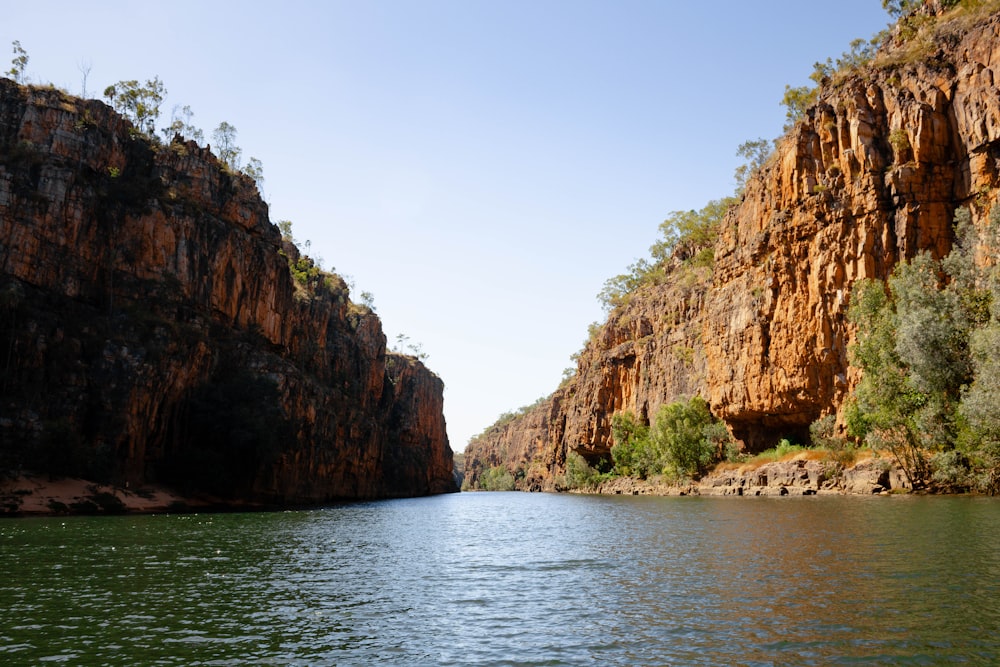 a body of water surrounded by mountains and trees