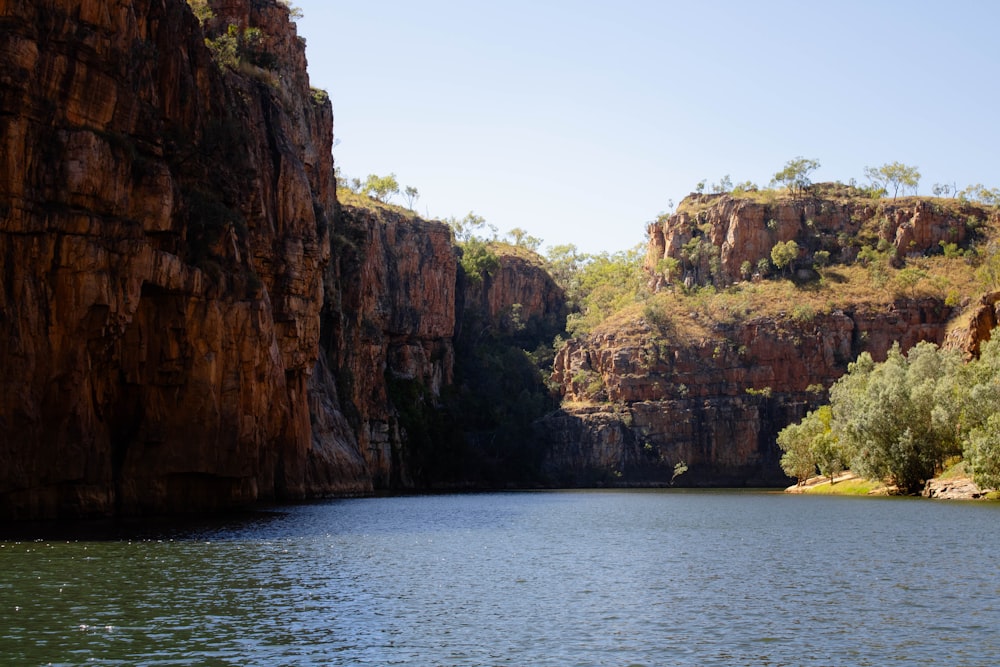 a body of water surrounded by mountains and trees