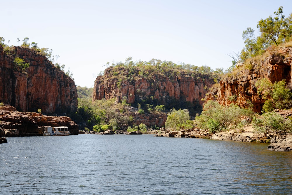 a body of water surrounded by mountains and trees