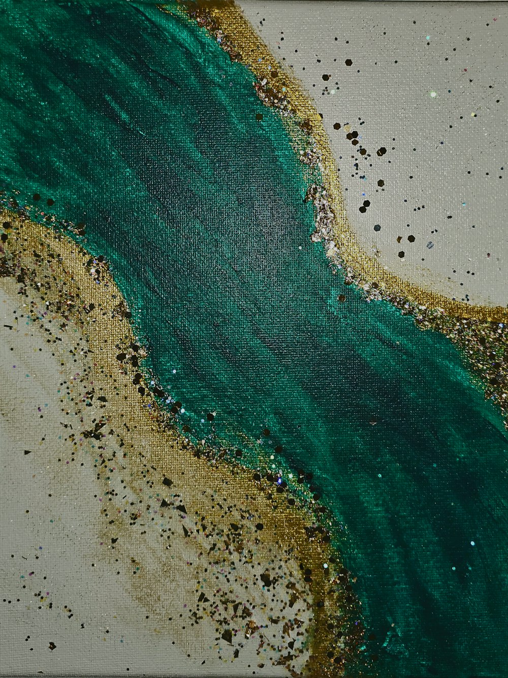 a painting with green and gold paint on it