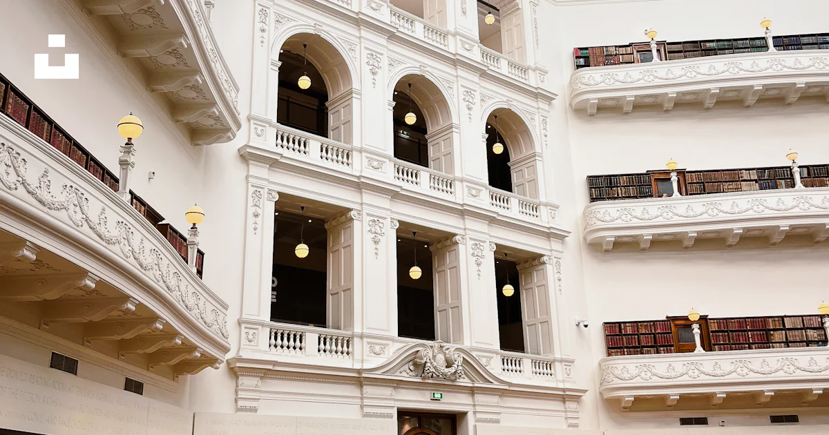 The interior of a large library with many bookshelves photo – Free City ...