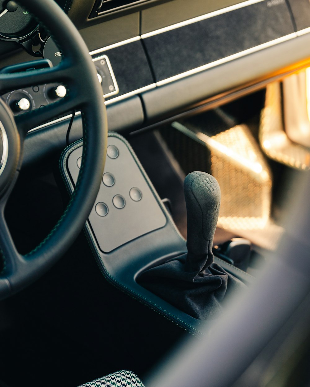 a close up of a steering wheel and dashboard of a car