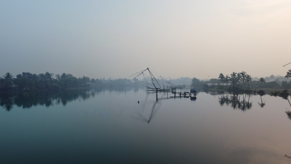 a large body of water surrounded by trees