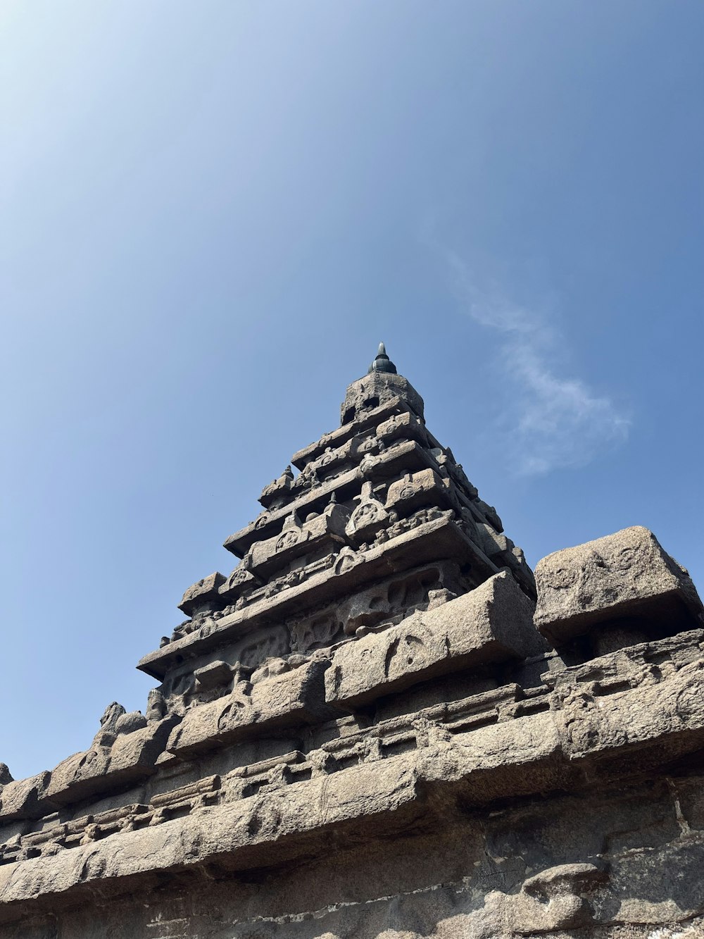 a tall stone structure with a sky in the background