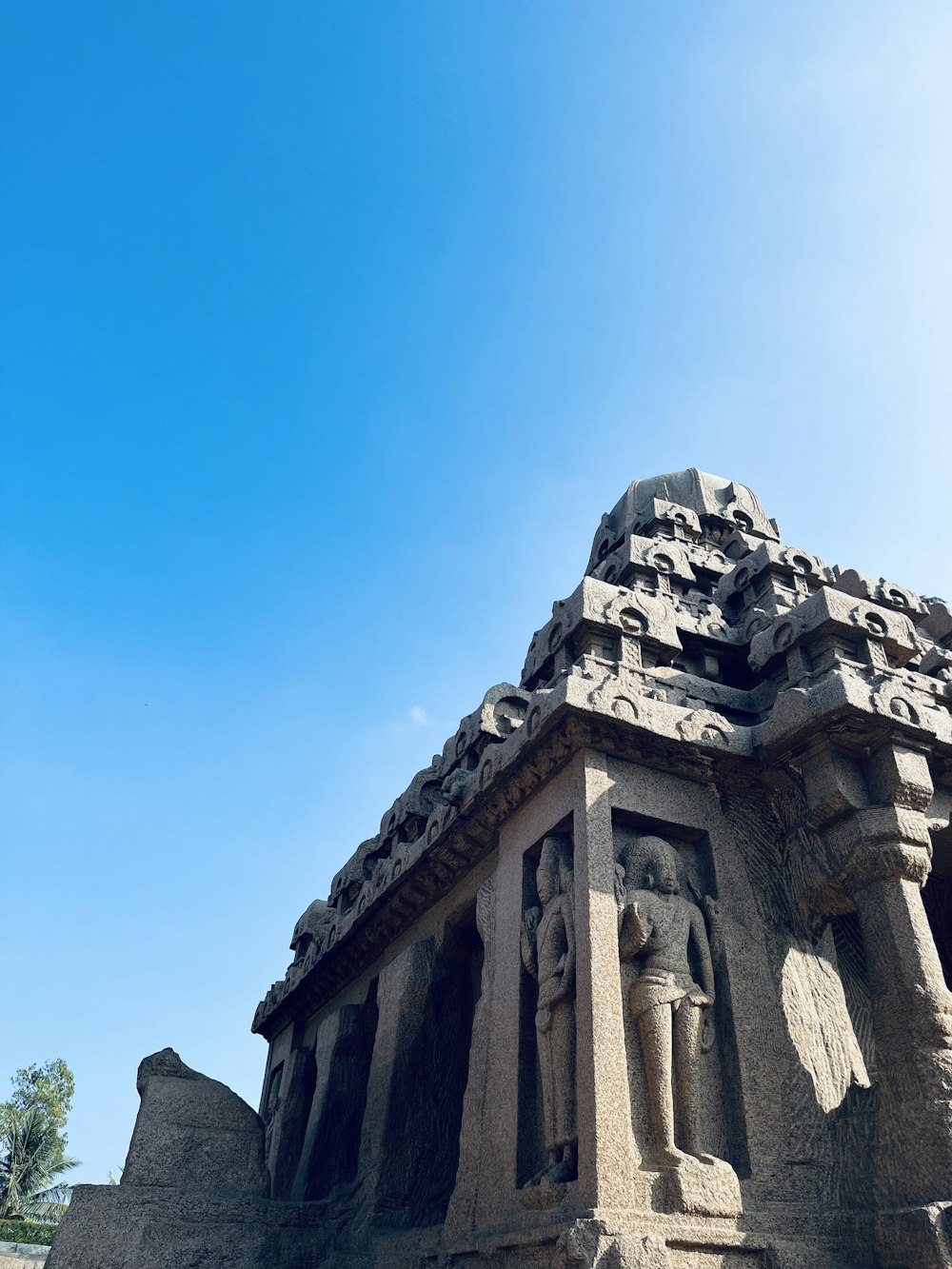 a large stone structure with a sky background