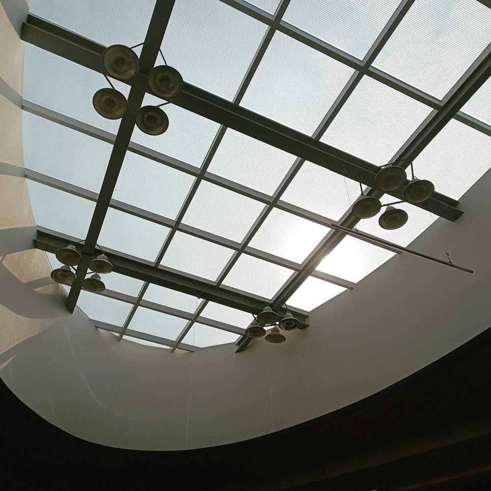 the ceiling of a building with a skylight above it