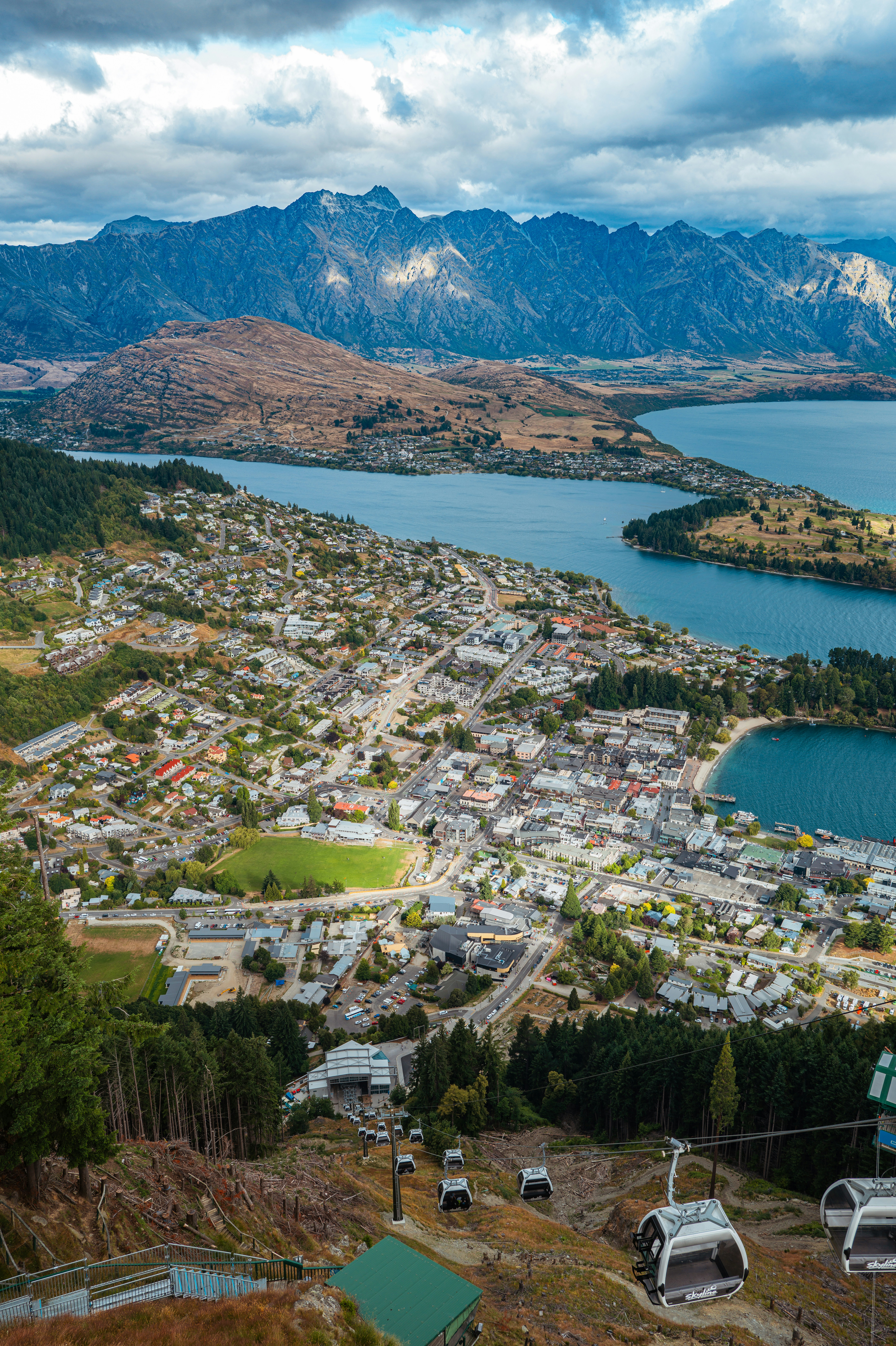 a scenic view of a town and a lake