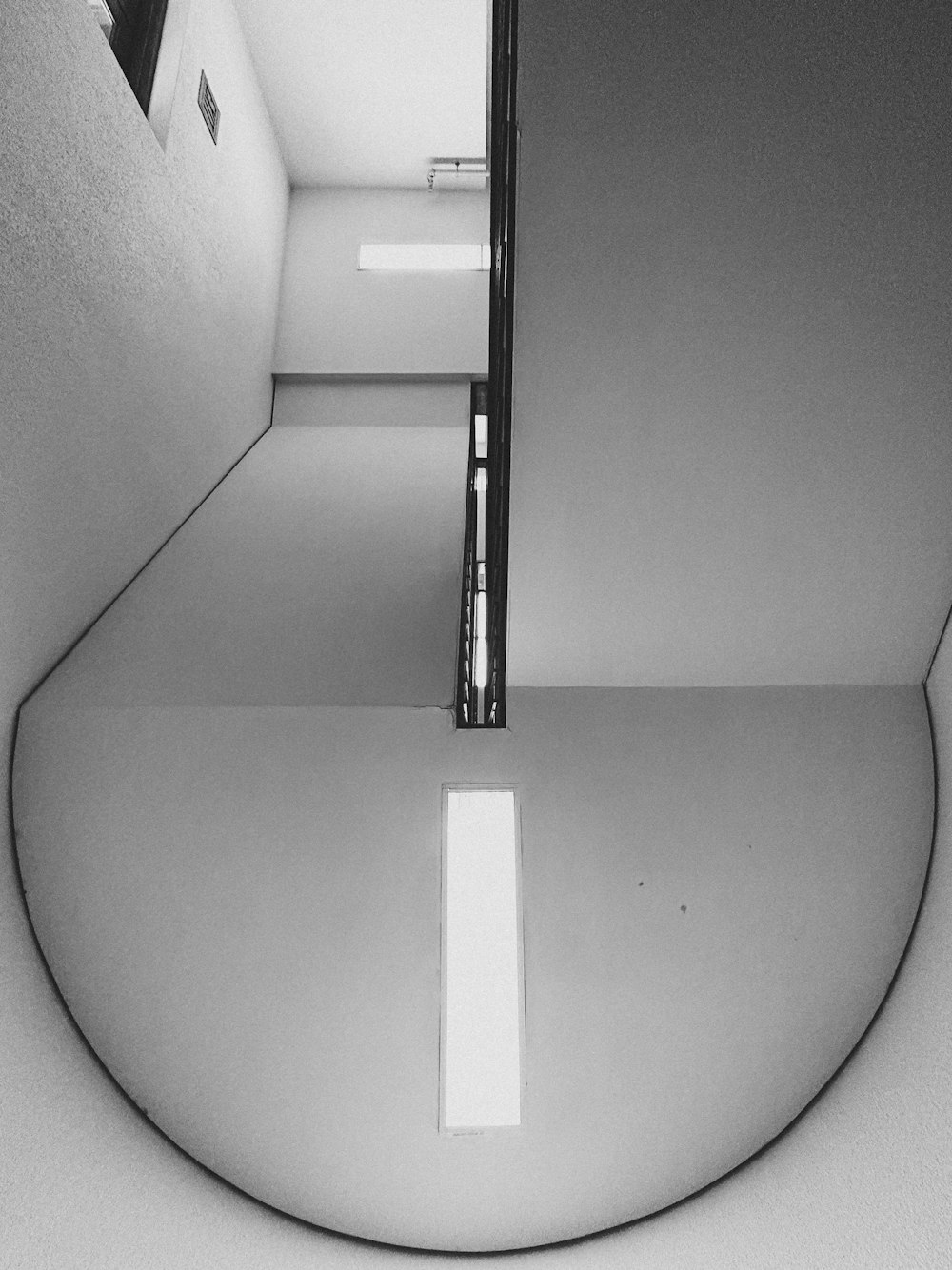 a black and white photo of a bathroom mirror