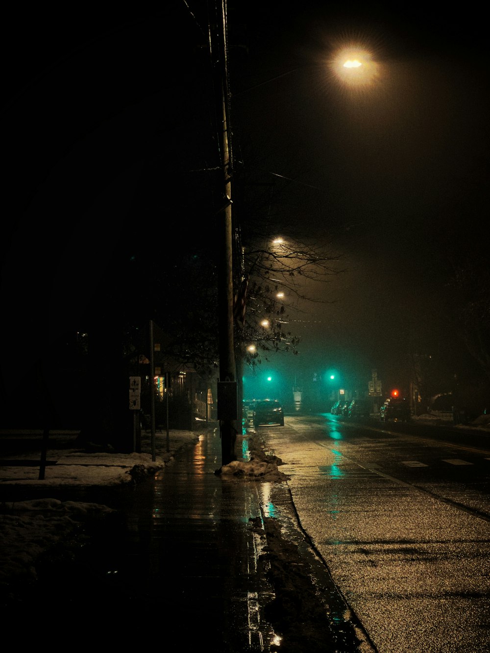 a city street at night with street lights