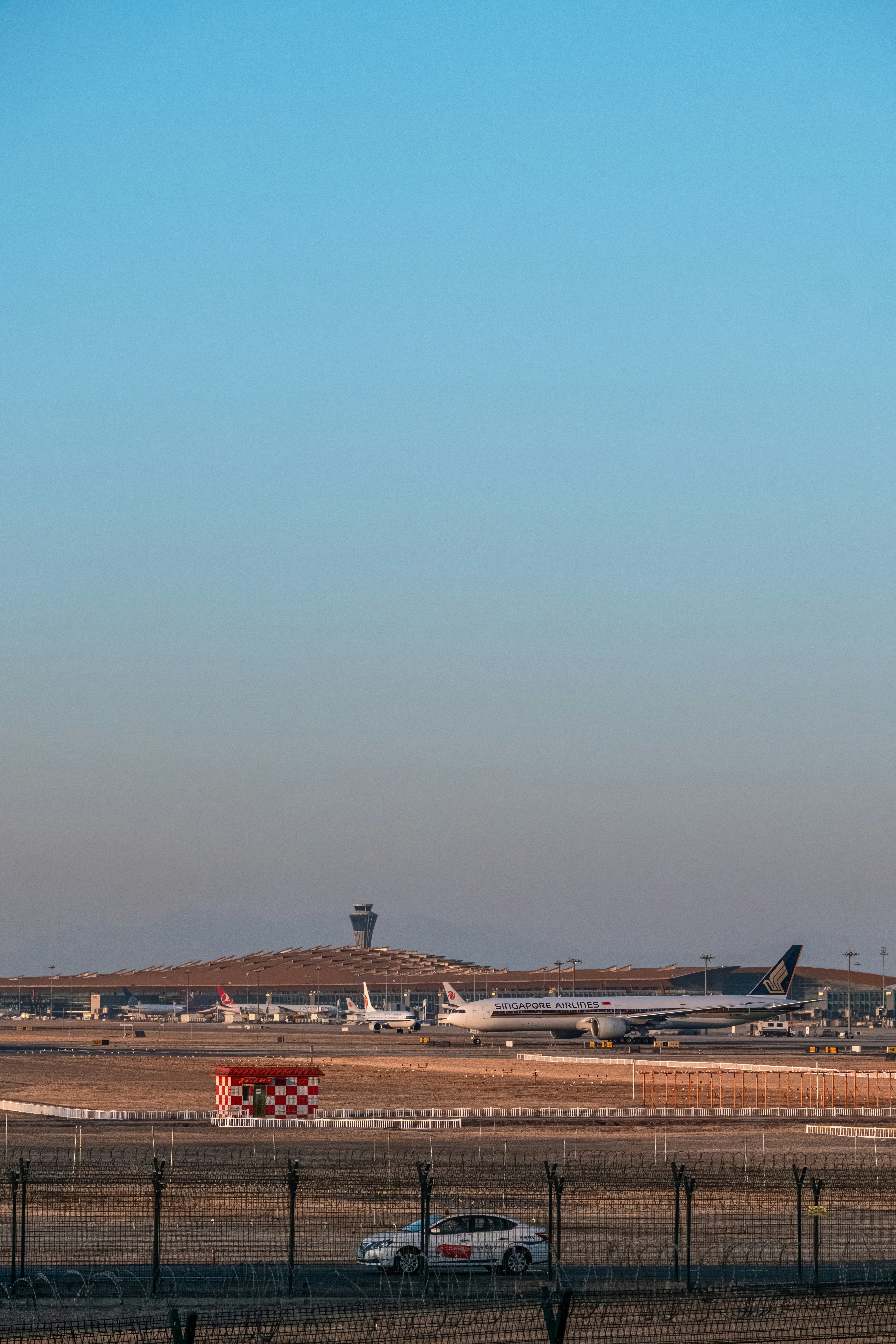 a large jetliner sitting on top of an airport tarmac