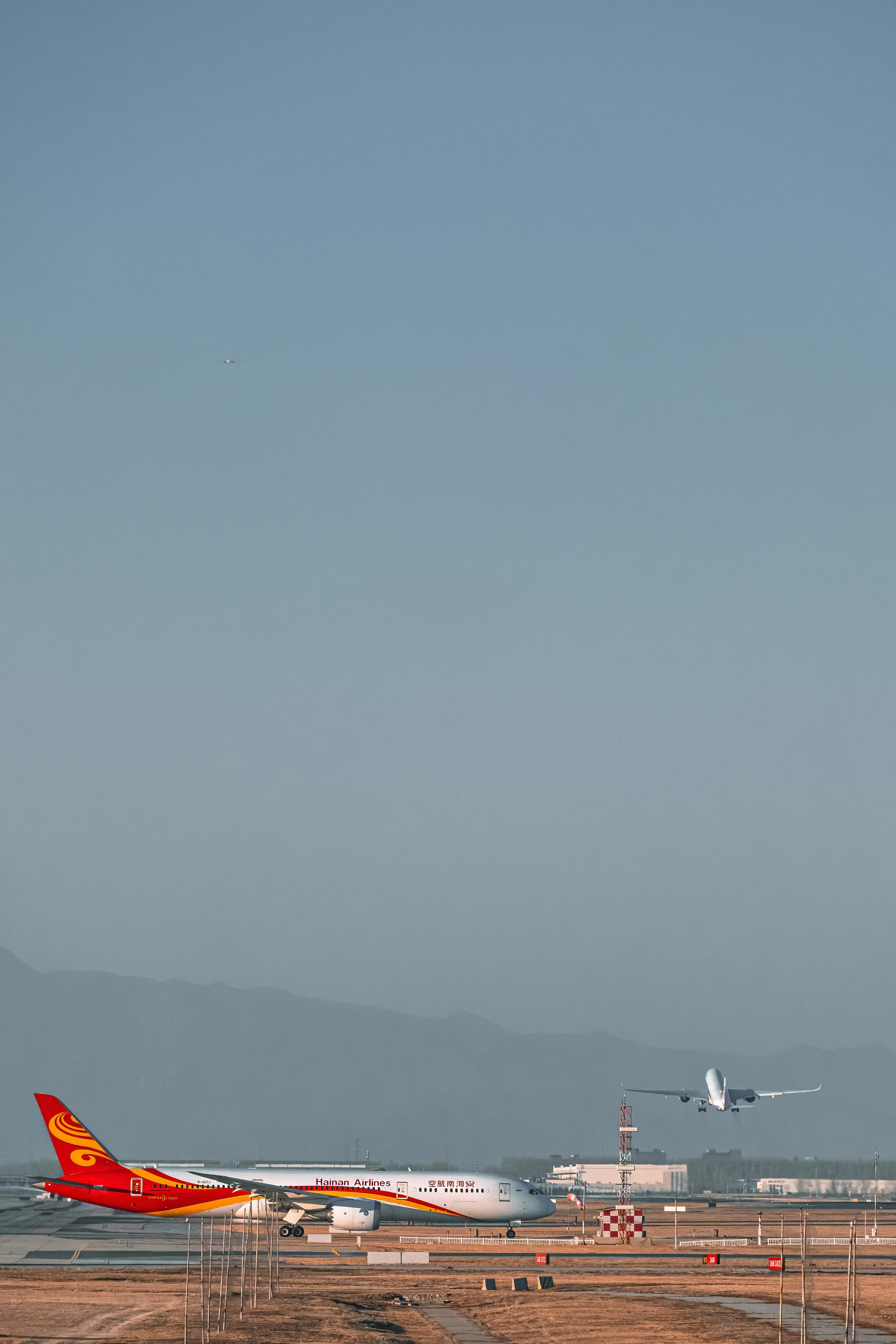 a large jetliner sitting on top of an airport tarmac