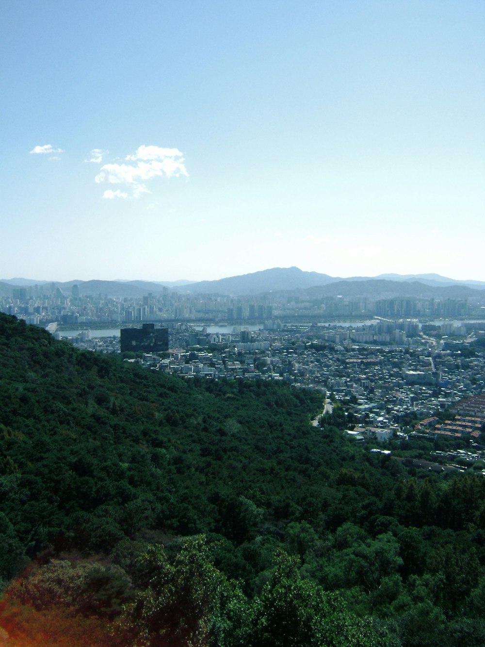 a view of a city from a hill