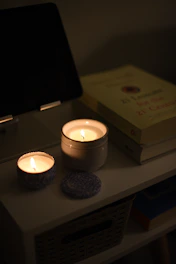 a couple of candles sitting on top of a table