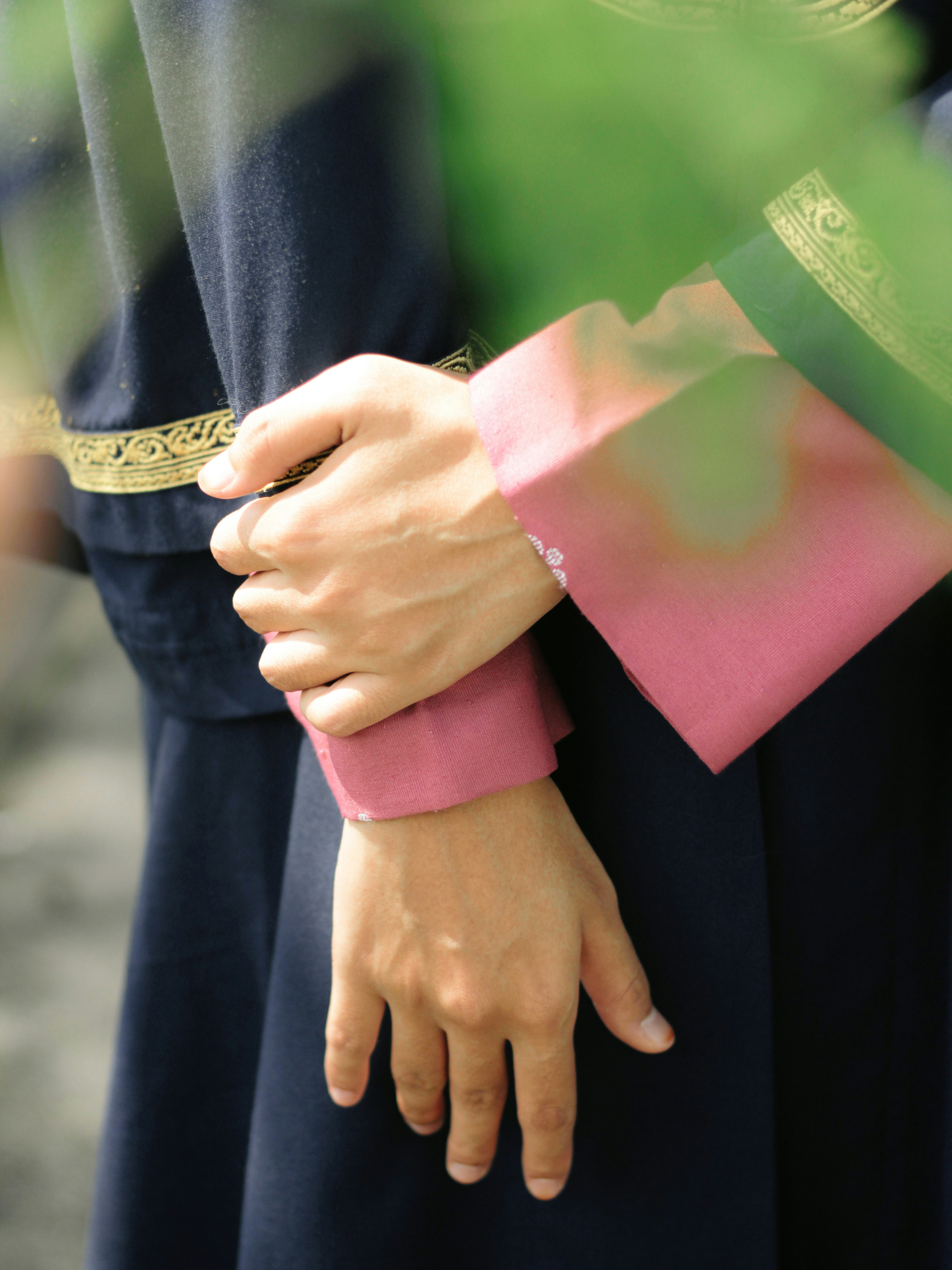 a close up of a person's hand with a wrist band