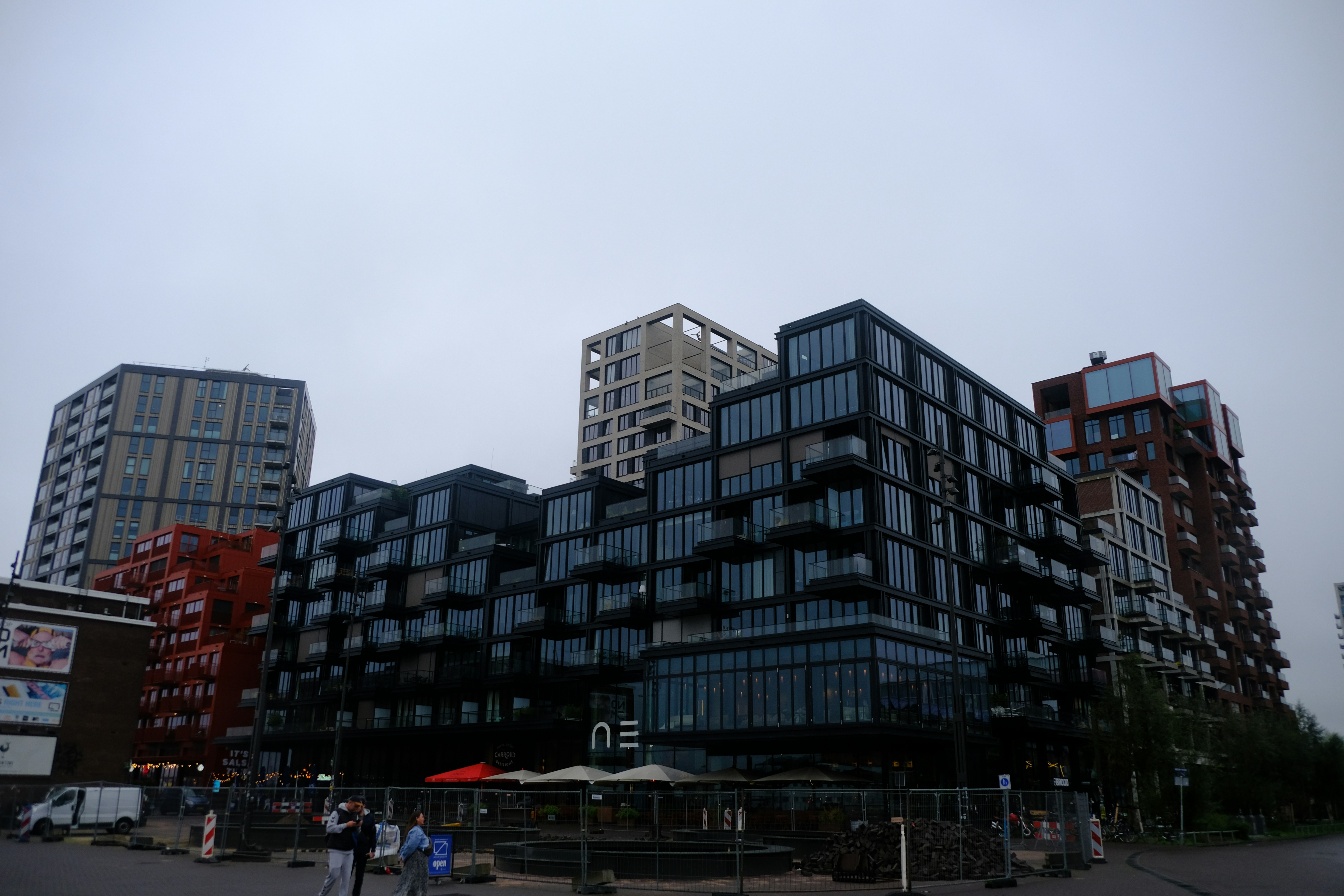 modern apartment building with young professionals - apartments for young professionals