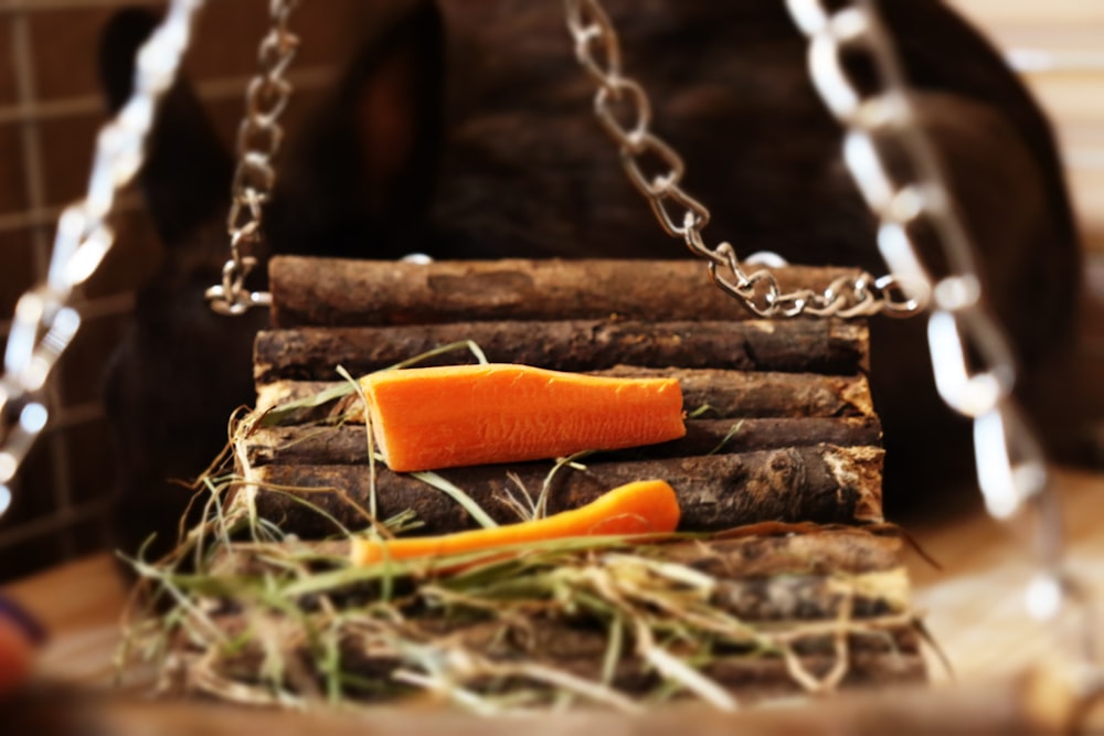a close up of a carrot on a chain