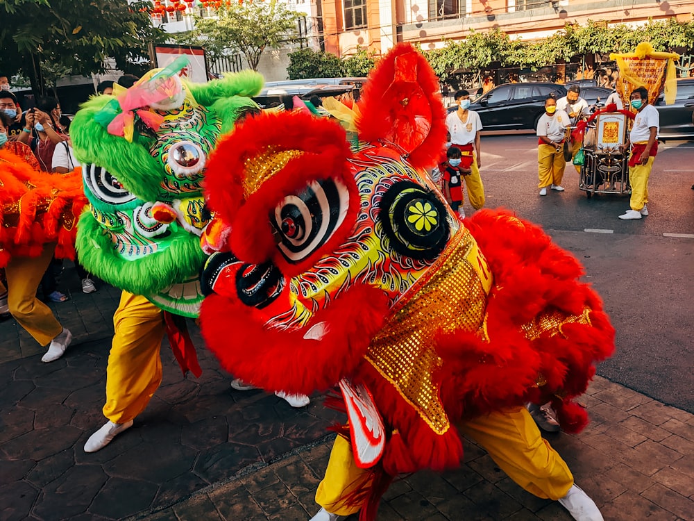 a group of people in colorful costumes walking down a street