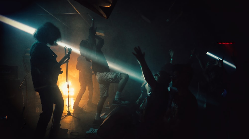 a group of people standing on top of a stage