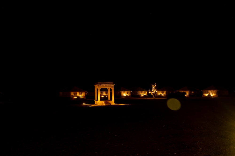 a couple of buildings lit up at night