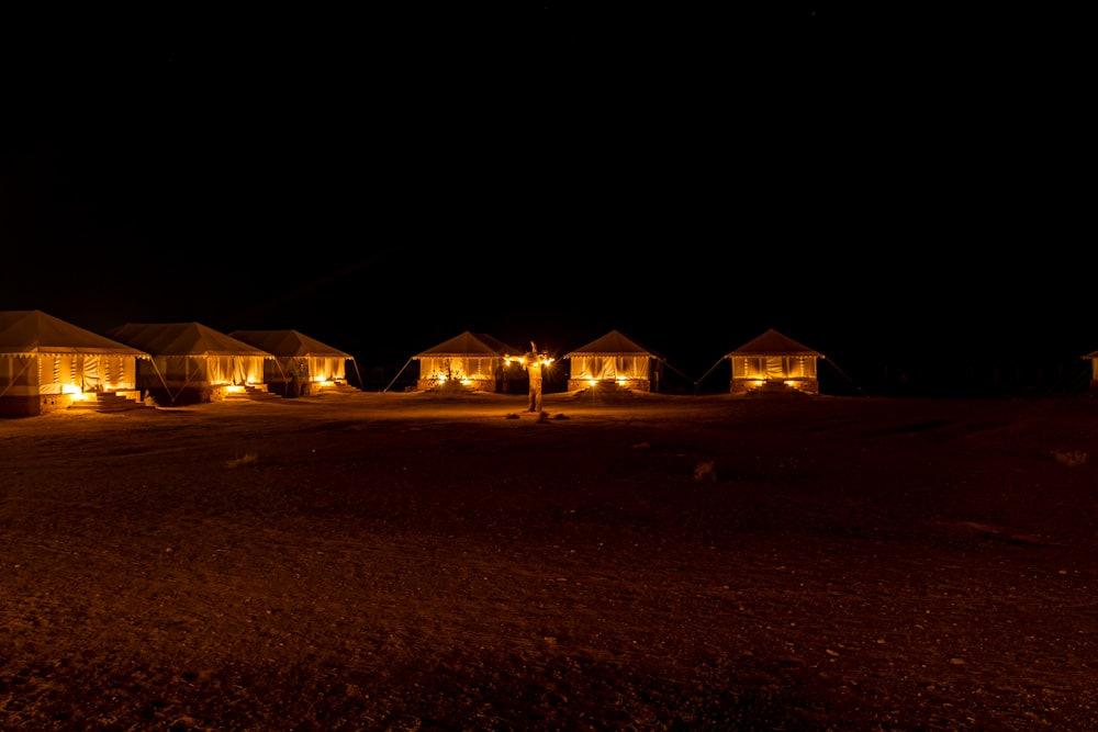 a row of houses lit up at night