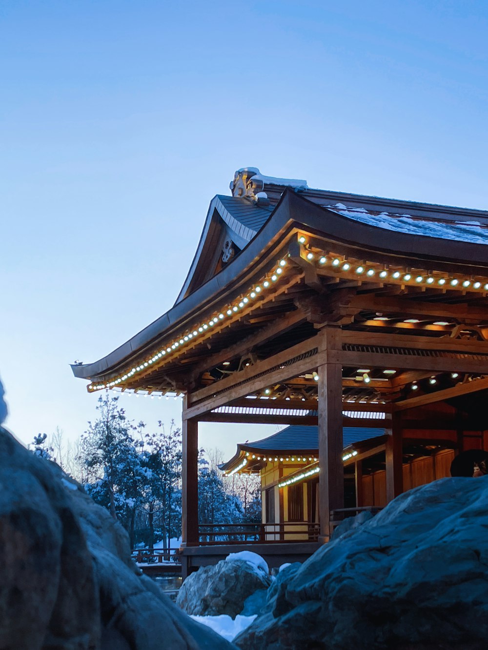 a small building with lights on top of it