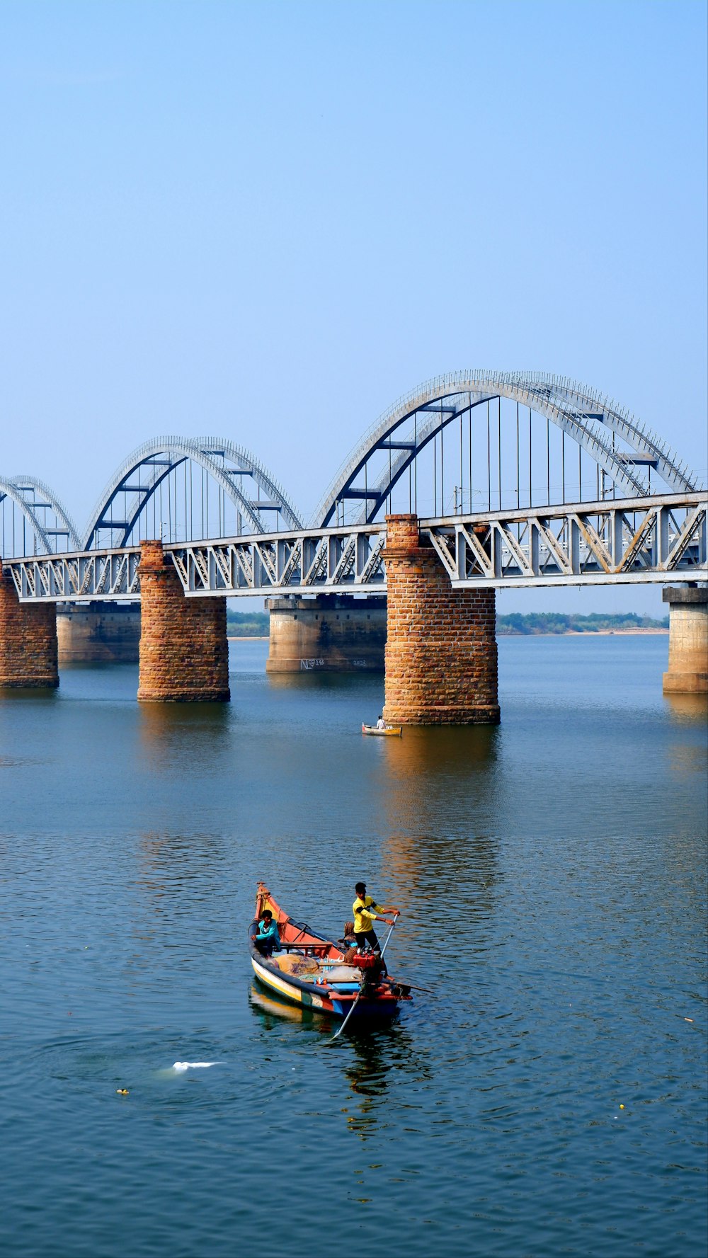 a couple of people in a small boat in the water