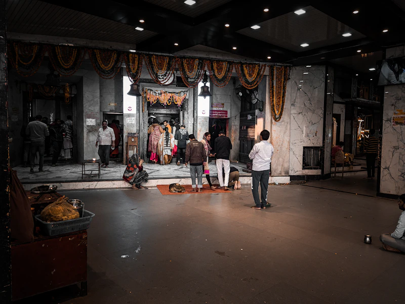 Busy Indian street scene with people near a store