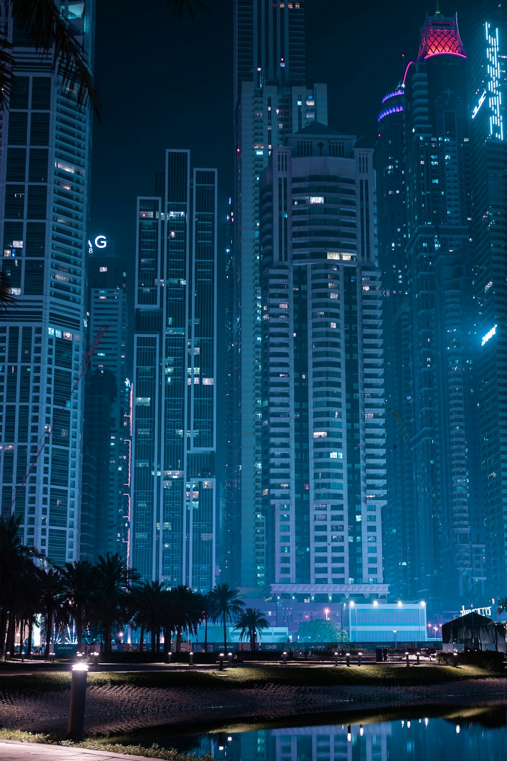 a city at night with a lot of tall buildings