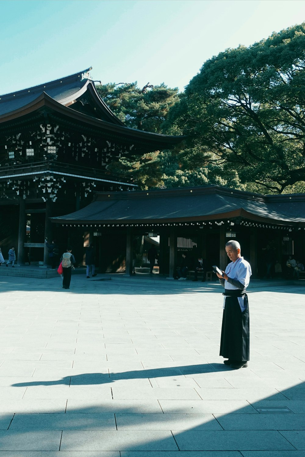 a woman standing in front of a tall building