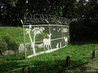 a fence with a picture of animals on it