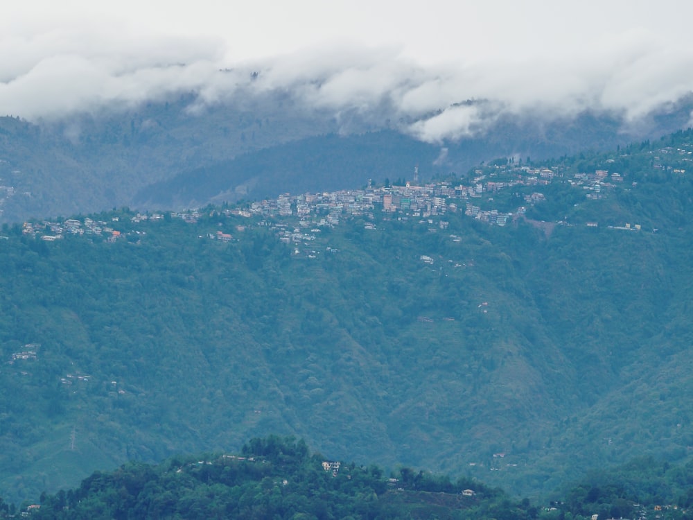 a view of a city in the distance with a mountain in the background