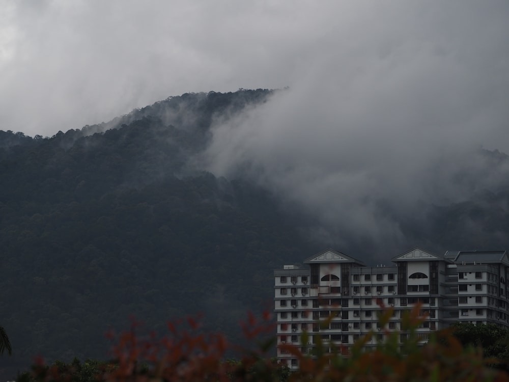 a view of a building with a mountain in the background