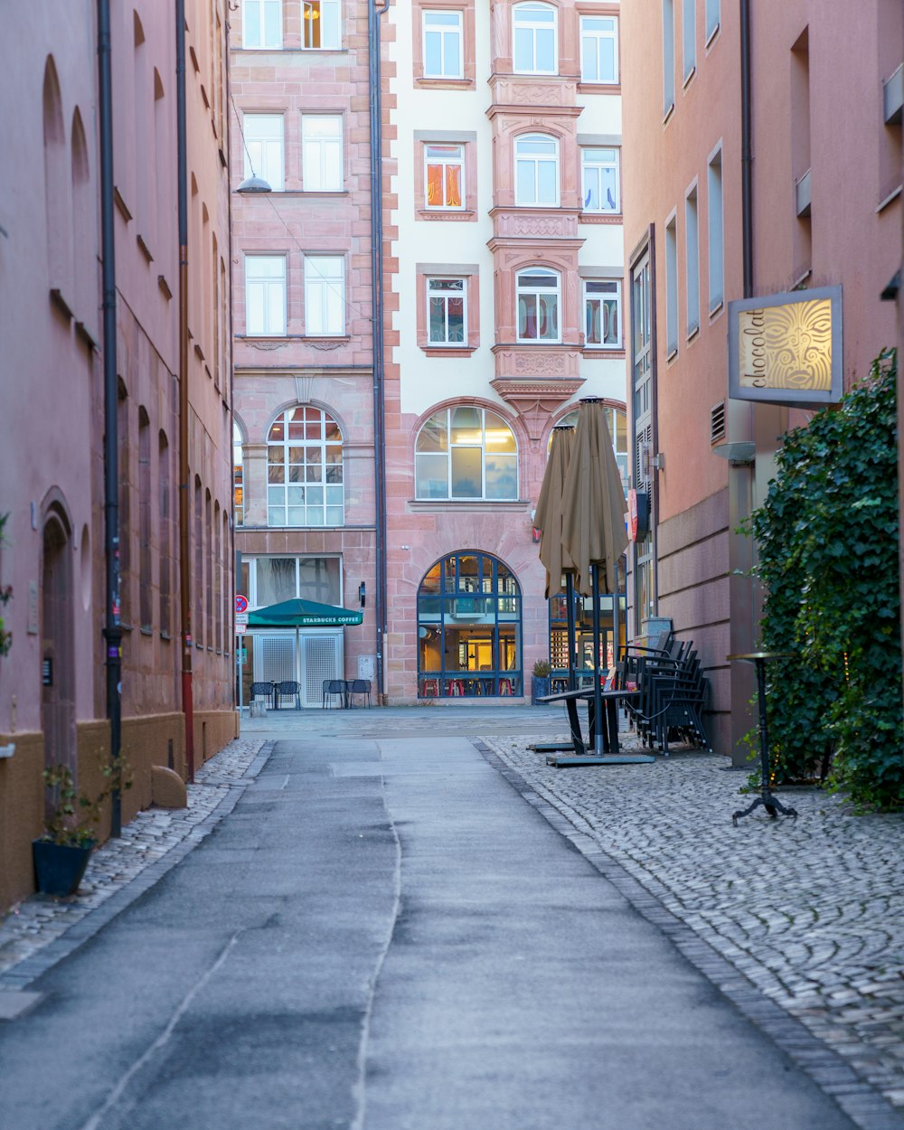 an empty street in a city with tall buildings