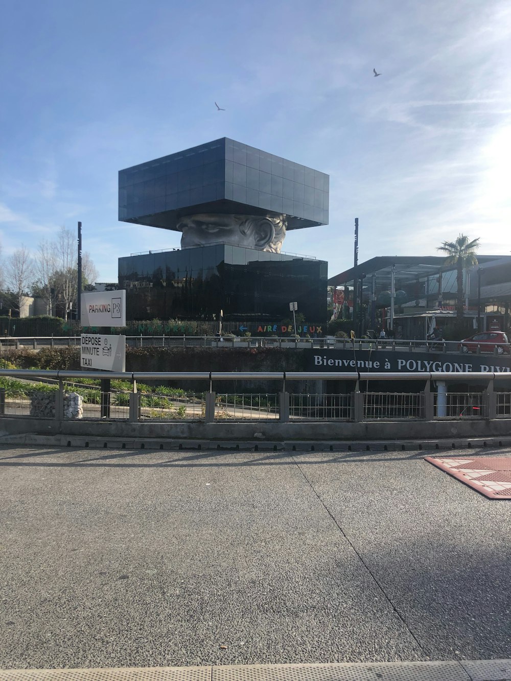 a large building with a giant face on the side of it