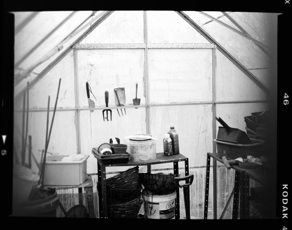 a black and white photo of a room with tools
