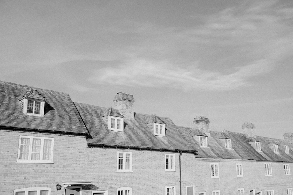 a black and white photo of a row of houses