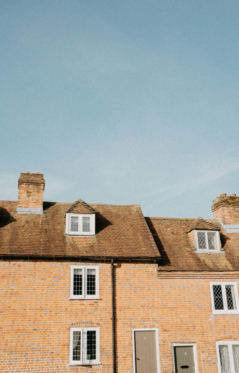 a brick building with a clock on the front of it