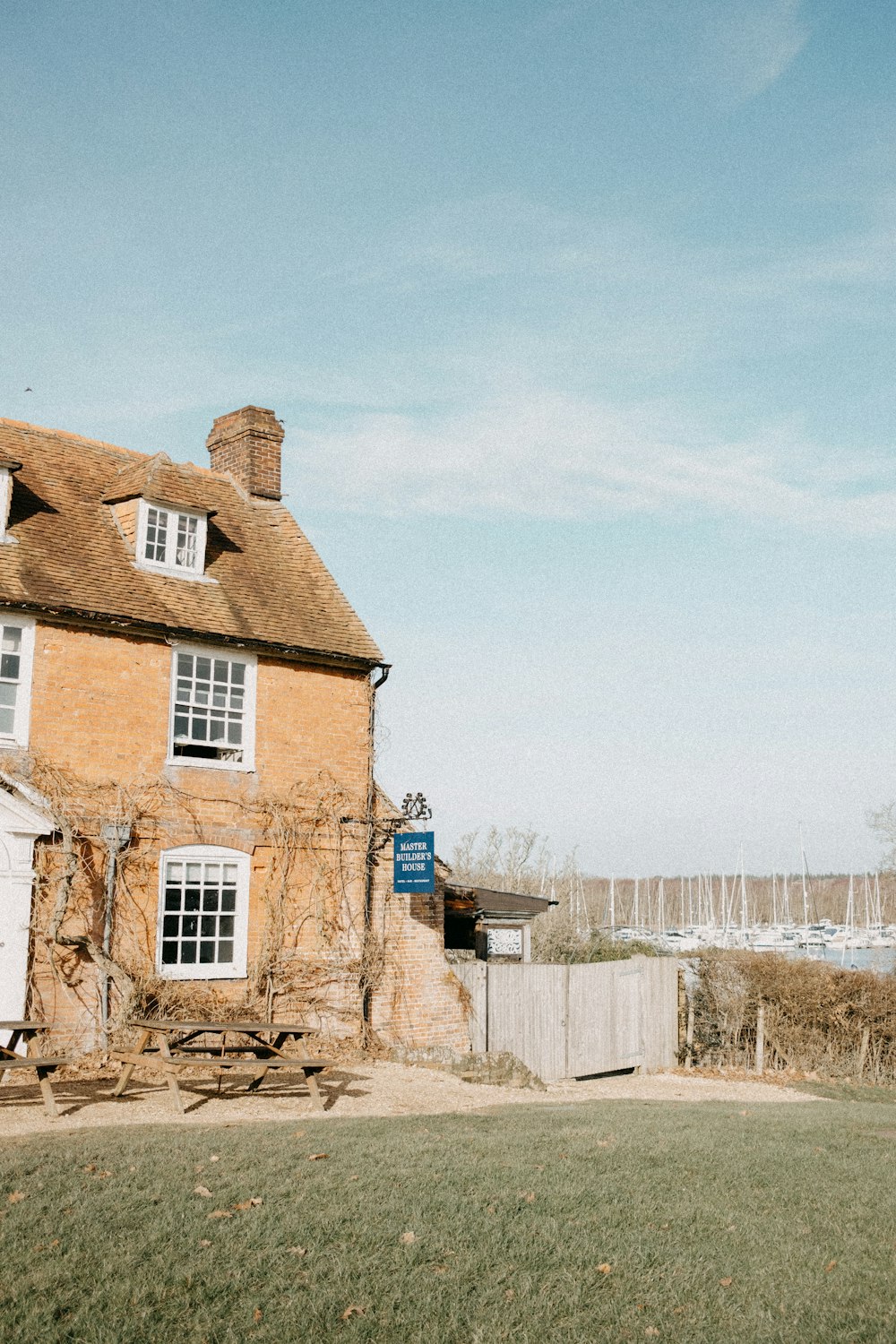 a house with a clock on the front of it