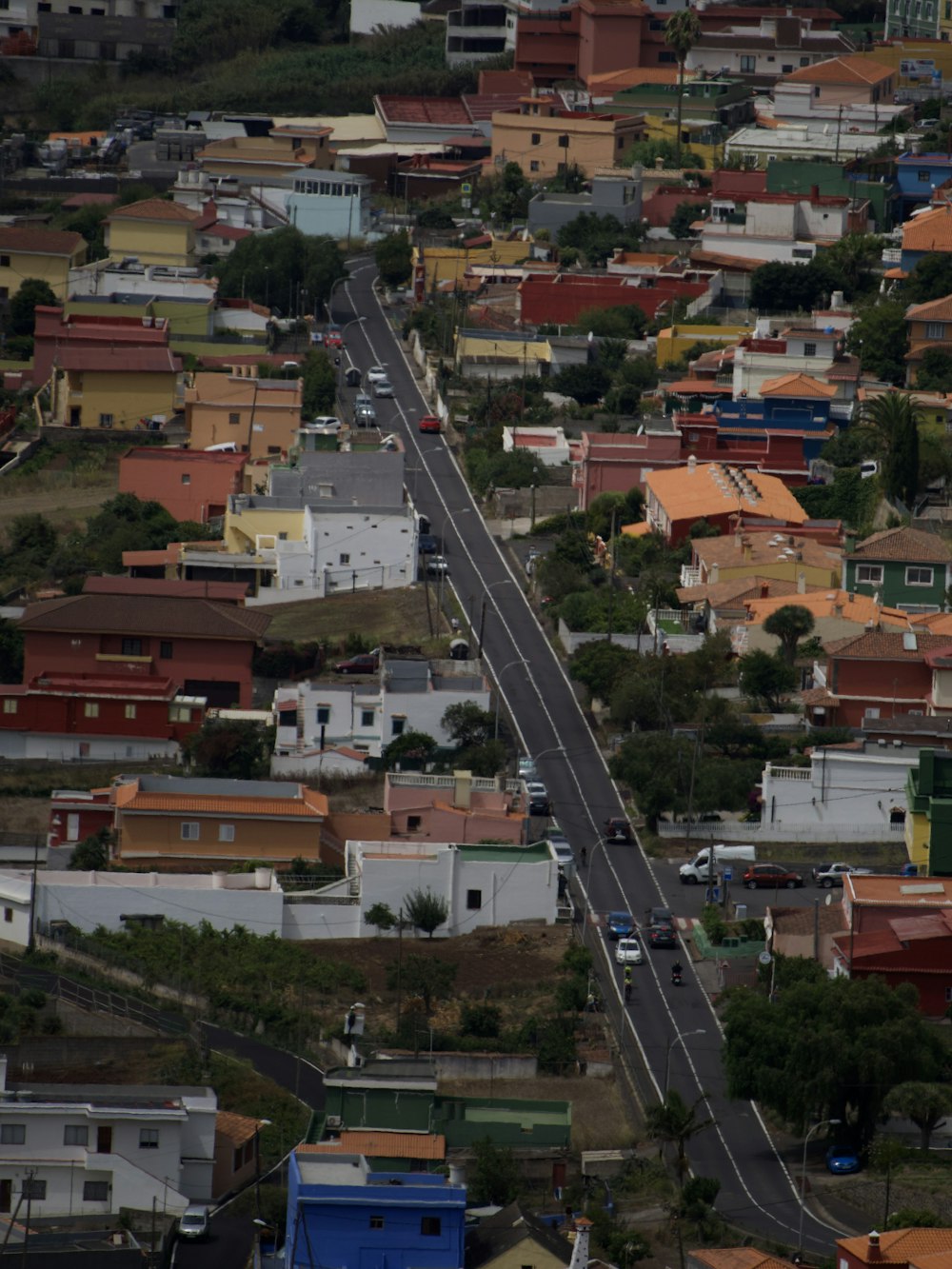 an aerial view of a street in a small town