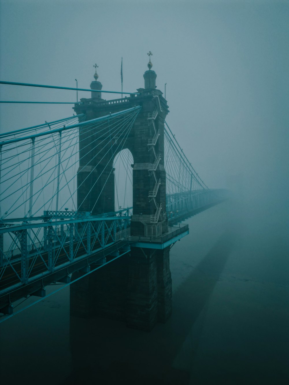 a bridge in the fog on a foggy day