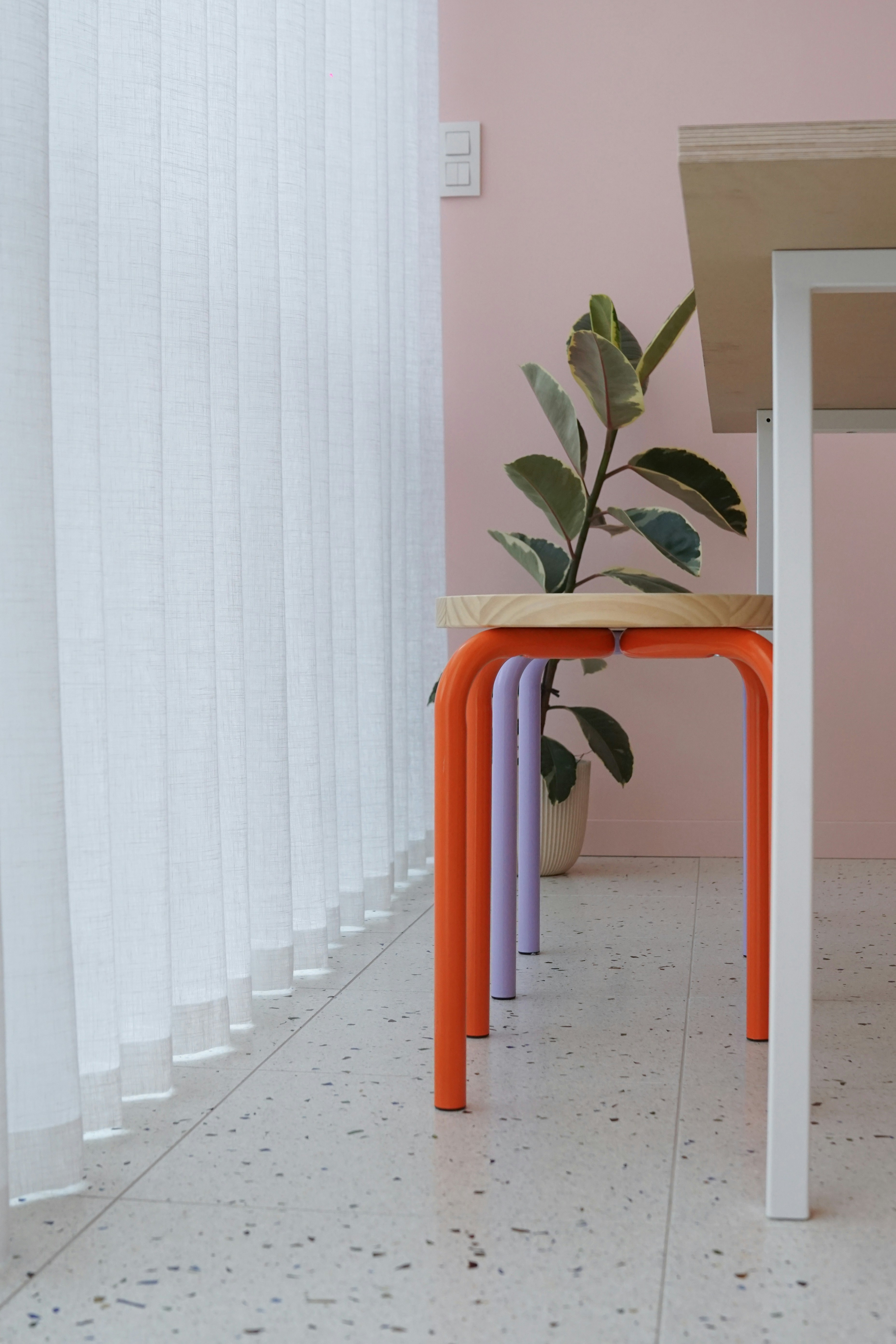 a table with a plant sitting on top of it