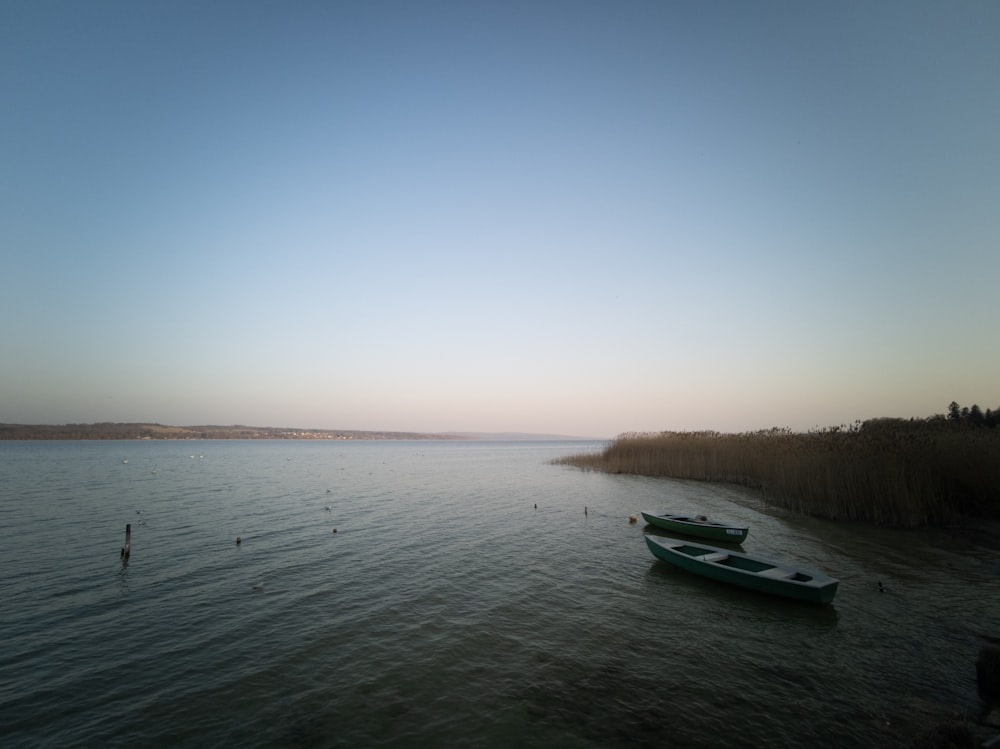 a couple of boats that are sitting in the water