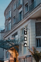 a building with a sign that reads cinema