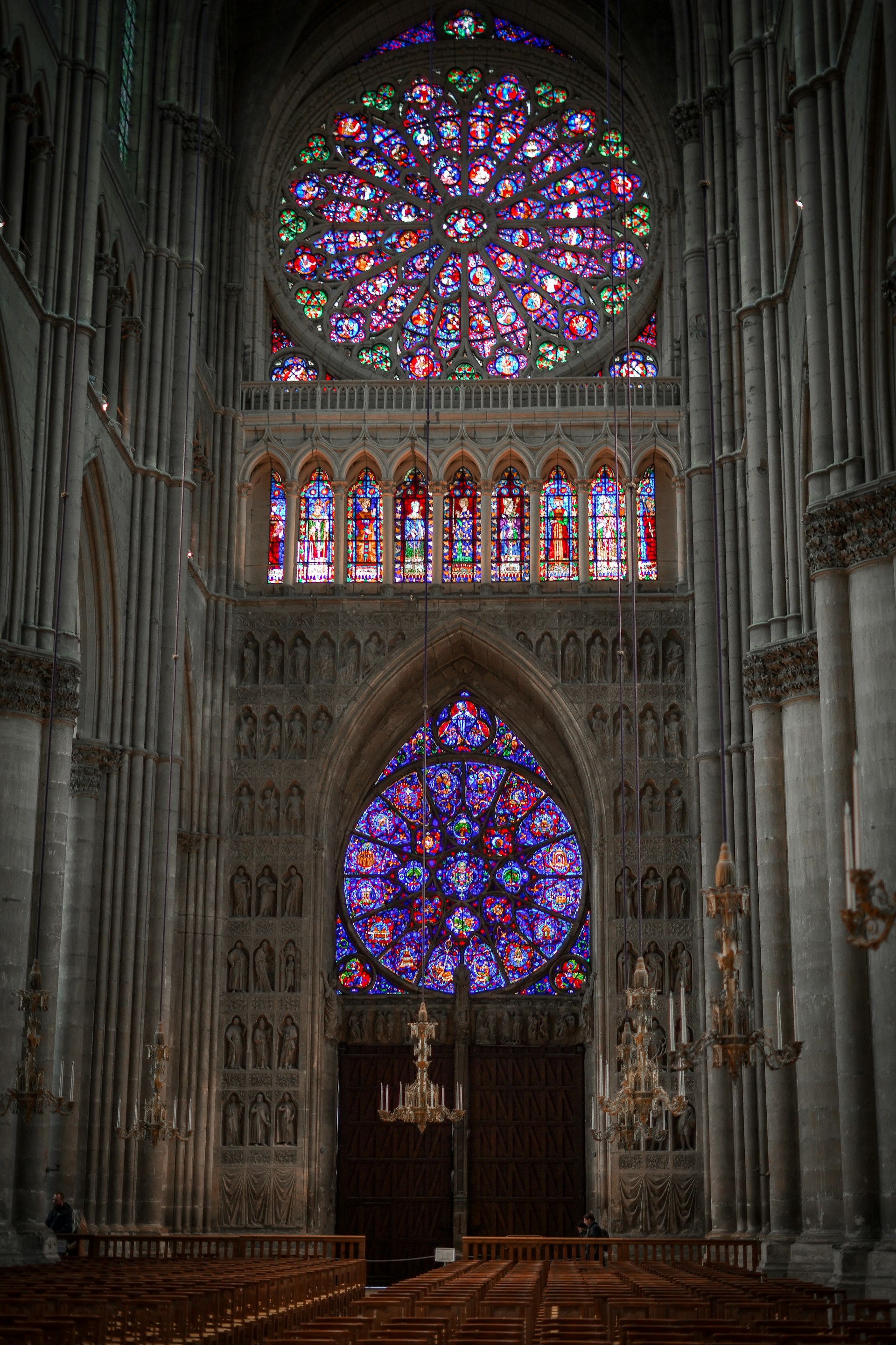 a large cathedral with stained glass windows and pews