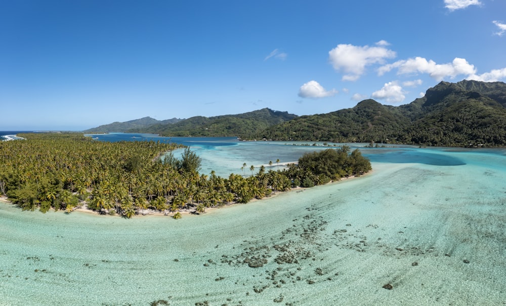 an aerial view of a tropical island in the middle of the ocean