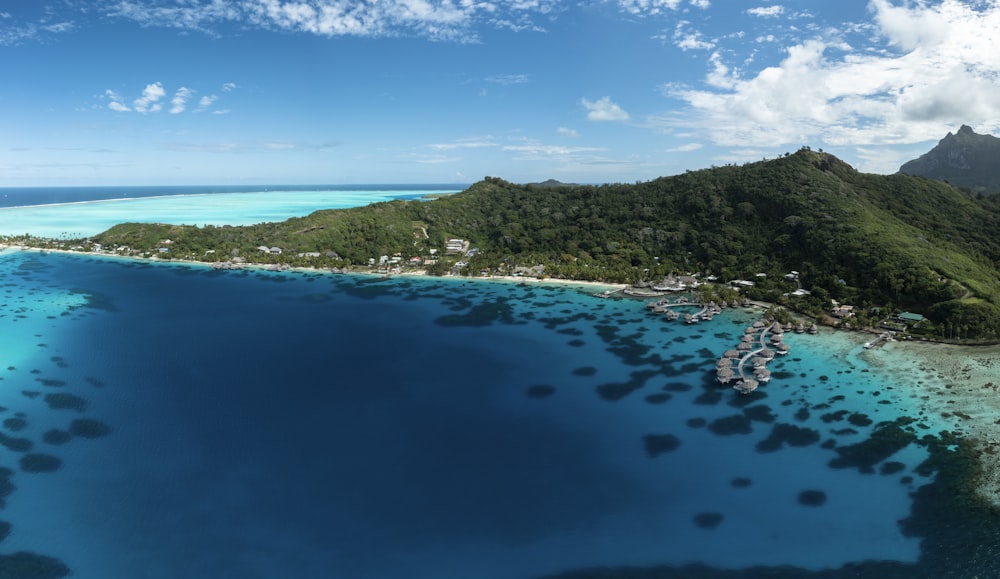 an aerial view of a tropical island in the middle of the ocean